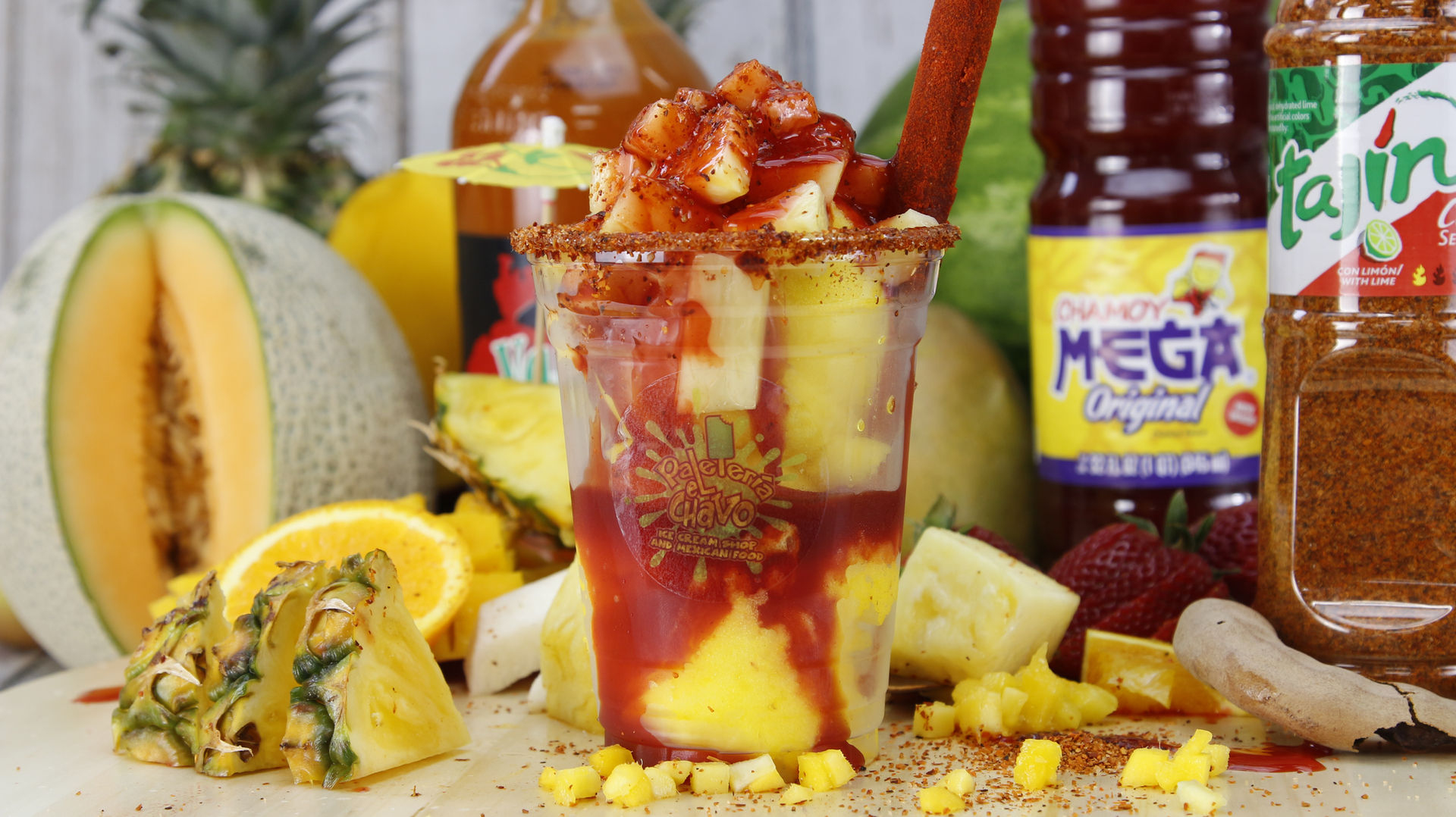 Full spread of Paleteria El Chavo specialties — paletas, ice cream scoops, and Mexican treats on a festive table